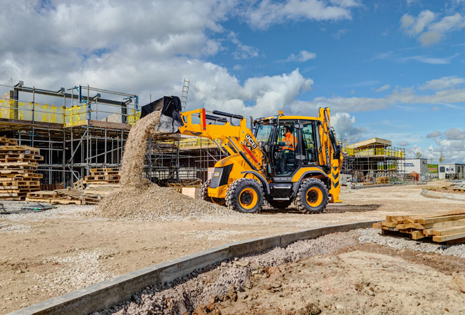 JCB 3CX Compact emptying its shovel